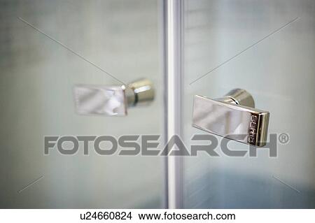 Detail stainless steel knobs on glass shower doors; Italy View Large Photo Image Picture - Detail stainless steel knobs on glass shower doors; Italy. Fotosearch