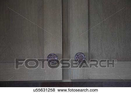 Detail wooden cabinets with decorative knobs; Porterville; California; USA View Large Photo Image Stock Photo - Detail wooden cabinets with decorative knobs; Porterville; California; USA. Fotosearch