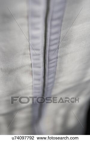 Stock Image - Detail zipper on back of chair cover. Fotosearch