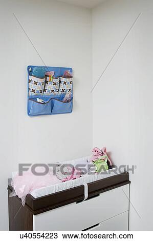 Stock Image - Diaper changing station in home. Fotosearch