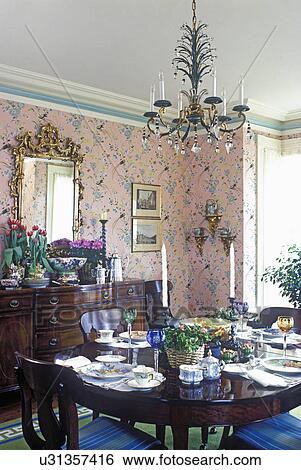 Stock Images Of Dining Room Traditional Greek Revival Formal Dining Room Traditional Greek Revival Formal Table Set Pink Print Wallpaper White Beige And Green Painted Trim Work Antique Furniture