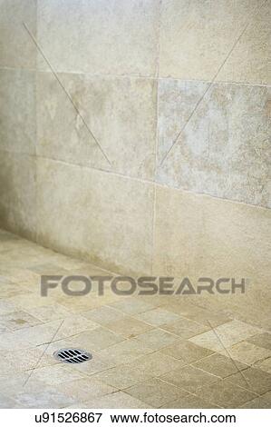 Stock Photo - Drain in earth tone tile shower; Cardiff by the Sea; California; USA. Fotosearch