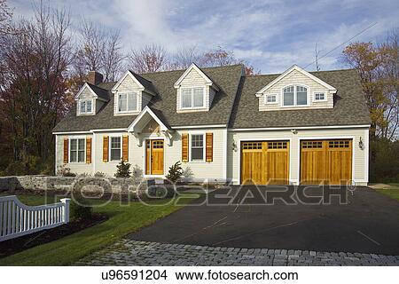 Picture - Driveway leading towards garage of single family home. Fotosearch