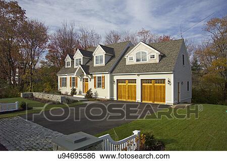 Driveway leading towards garage of single family home View Large Photo Image Stock Photograph - Driveway leading towards garage of single family home. Fotosearch