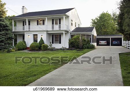 Driveway to garage and colonial style home; Potomac; Maryland; USA View Large Photo Image Stock Photo - Driveway to garage and colonial style home; Potomac; Maryland; USA. Fotosearch