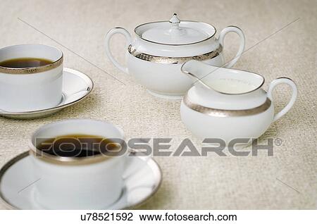 Elegant coffee cups with cream and sugar set View Large Photo Image Stock Image - Elegant coffee cups with cream and sugar set. Fotosearch