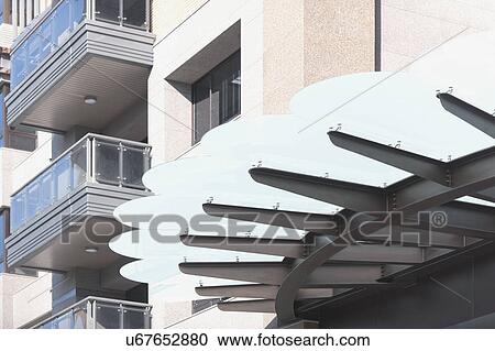 Entrance shade of a residential apartment building View Large Photo Image Stock Image - Entrance shade of a residential apartment building. Fotosearch