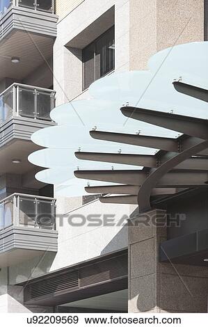 Entrance shade of a residential apartment building View Large Photo Image Stock Photo - Entrance shade of a residential apartment building. Fotosearch