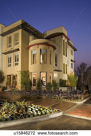Stock Image - Exterior contemporary live work loft at dusk; Aliso Viejo; California; USA. Fotosearch