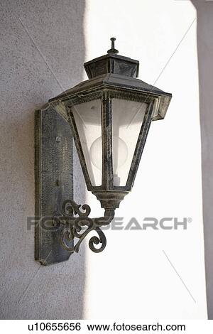 Stock Photograph - Exterior light mounted on wall; Trabuco Canyon; California; USA. Fotosearch