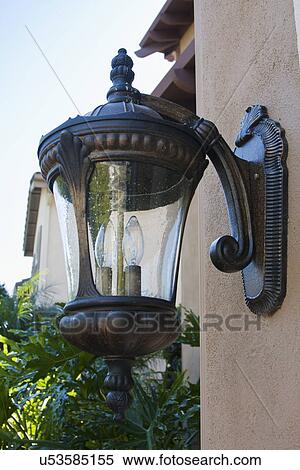 Stock Photography - Exterior light mounted on wall; Trabuco Canyon; California; USA. Fotosearch
