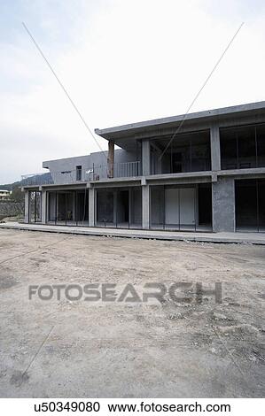 Exterior modern home under construction View Large Photo Image Stock Image - Exterior modern home under construction. Fotosearch