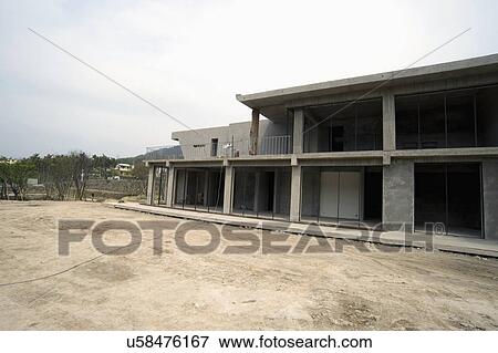 Exterior modern home under construction View Large Photo Image Stock Photo - Exterior modern home under construction. Fotosearch