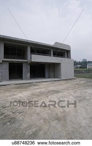 Exterior modern home under construction View Large Photo Image Stock Photograph - Exterior modern home under construction. Fotosearch