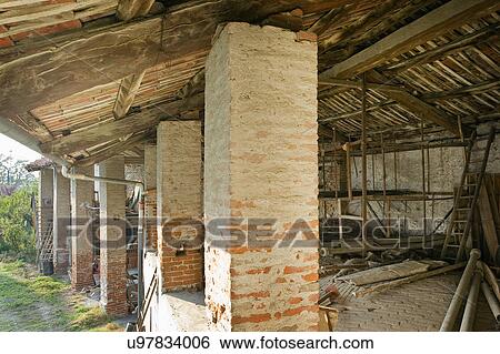 Stock Photograph - Exterior of a damaged house, Albiano d'Ivrea, Italy. Fotosearch