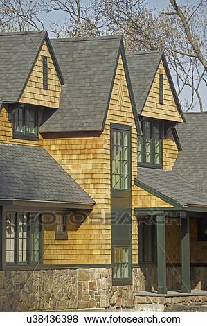 Stock Photo - Exterior of a of single family home with shingled roof. Fotosearch