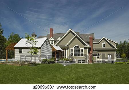 Exterior of a single family home against cloudy sky View Large Photo Image Stock Photo - Exterior of a single family home against cloudy sky. Fotosearch