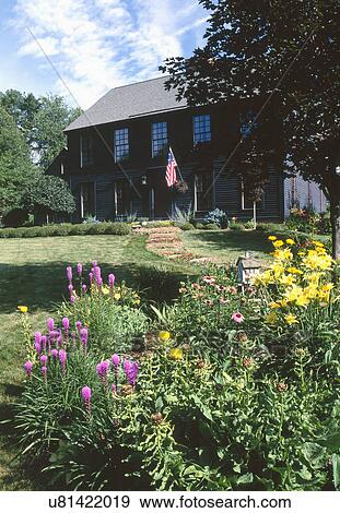 Exterior of a two story house surrounded by garden View Large Photo Image Stock Photo - Exterior of a two story house surrounded by garden. Fotosearch