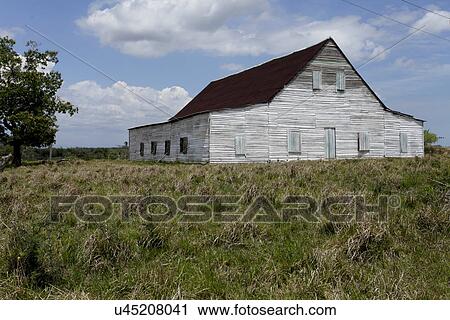 Stock Image - Exterior of an old barn, Cuba, Vinales. Fotosearch