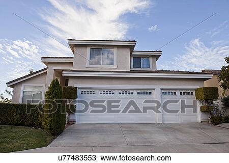 Exterior of middle class home with garages and driveway, Laguna Beach, California, USA View Large Photo Image Stock Image - Exterior of middle class home with garages and driveway, Laguna Beach, California, USA. Fotosearch