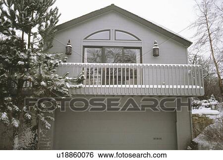 Exterior of traditional house with white railing in balcony View Large Photo Image Stock Photograph - Exterior of traditional house with white railing in balcony. Fotosearch