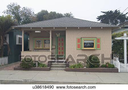 Stock Image - Exterior view of a one story cottage at Pacific Grove; California; USA. Fotosearch