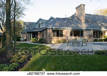 Stock Photo - Exterior view of a traditional home. Fotosearch