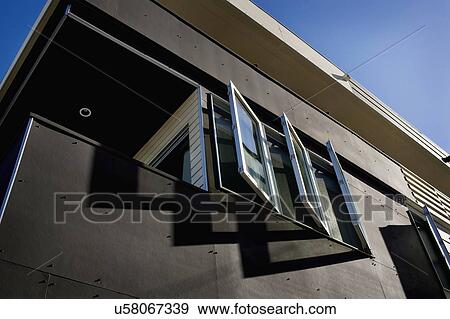 Stock Photo - Exterior view of open casement windows on home. Fotosearch