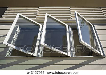 Stock Photography - Exterior view of open casement windows on home. Fotosearch