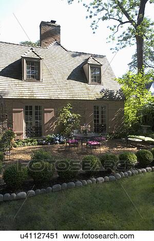 Exteriors French Country Style Brick Home With Shutters Dormers