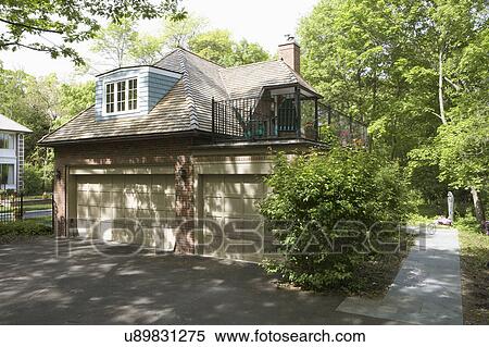EXTERIORS: Garage, non-attached, straight on view, two story, 3 car, dormer, cedar shake, blacktop driveway, 2nd floor deck to right View Large Photo Image Stock Photography - EXTERIORS: Garage, non-attached, straight on view, two story, 3 car, dormer, cedar shake, blacktop driveway, 2nd floor deck to right . Fotosearch
