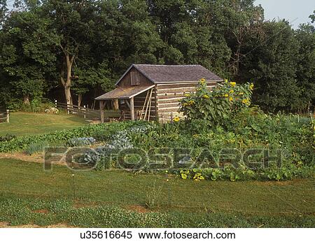 Stock Photography - EXTERIORS: Log Building near garden. Horizontal. . Fotosearch