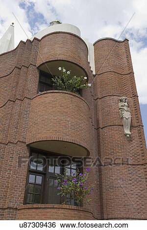 EXTERIORS; Two rounded patio balconies, flowering trees on each, View Large Photo Image Stock Photograph - EXTERIORS; Two rounded patio balconies, flowering trees on each,. Fotosearch