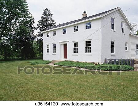 EXTERIORS: Two-story single family stucco Georgian Colonial farmhouse, built in 1841, restored, lawn, plain and simple, horizontal version, ground cover near house, View Large Photo Image Stock Image - EXTERIORS: Two-story single family stucco Georgian Colonial farmhouse, built in 1841, restored, lawn, plain and simple, horizontal version, ground cover near house,. Fotosearch