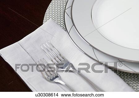 Extreme close-up of an elegant place setting on dining table View Large Photo Image Picture - Extreme close-up of an elegant place setting on dining table. Fotosearch