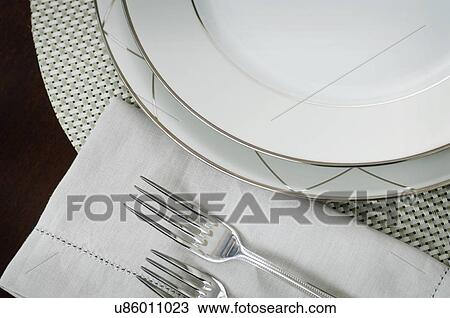 Extreme close-up of an elegant place setting on dining table View Large Photo Image Stock Image - Extreme close-up of an elegant place setting on dining table. Fotosearch