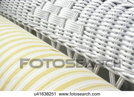 Stock Image - Extreme close-up of white wicker chair. Fotosearch