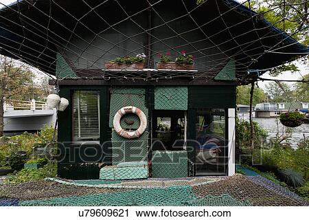 Facade of cottage covered with fishing nets View Large Photo Image Stock Image - Facade of cottage covered with fishing nets. Fotosearch