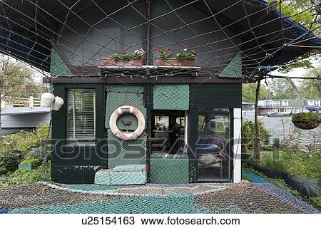 Facade of house covered in fishing net View Large Photo Image Stock Image - Facade of house covered in fishing net. Fotosearch