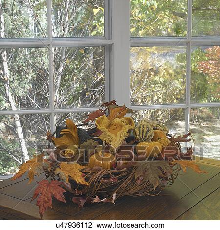 FALL SEASON: twig basket filled with gourds and pumpkins, leaves, paned windows behind. more windows View Large Photo Image Stock Image - FALL SEASON: twig basket filled with gourds and pumpkins, leaves, paned windows behind. more windows. Fotosearch