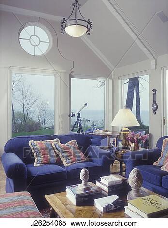 Family Room Vaulted Ceiling With Circular Window Cream Colored