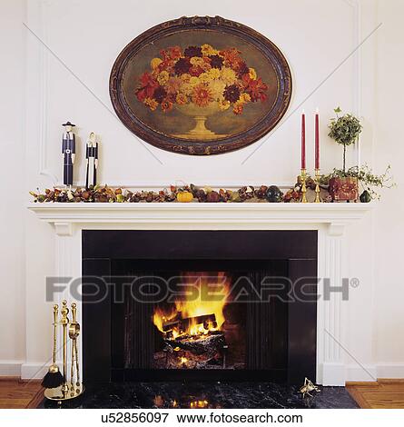 fireplace with thanksgiving decor, fruit, pilgrims, painting View Large Photo Image Stock Photo - fireplace with thanksgiving decor, fruit, pilgrims, painting . Fotosearch