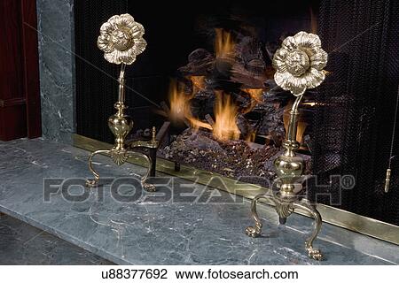 FIREPLACES: brass flower andirons, green marble hearth behind View Large Photo Image Stock Image - FIREPLACES: brass flower andirons, green marble hearth behind. Fotosearch