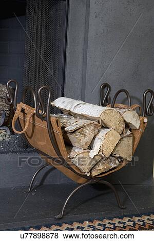 Stock Photo - FIREPLACES: log carrier, iron stand, removable leather to gather logs from outside and set them right into carrier. Fotosearch