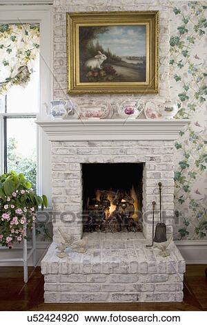 Fireplaces White Painted Brick Fireplace In Kitchen Eating Area Ivy Wallpaper Rabbit Painting Teapots On Mantel Raised Hearth Stock Image U Fotosearch