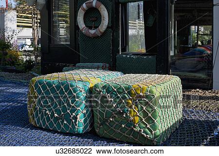 Floating buoys wrapped with commercial fishing nets View Large Photo Image Stock Image - Floating buoys wrapped with commercial fishing nets. Fotosearch