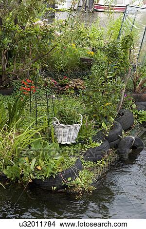 Floating cottage with flower garden View Large Photo Image Picture - Floating cottage with flower garden. Fotosearch