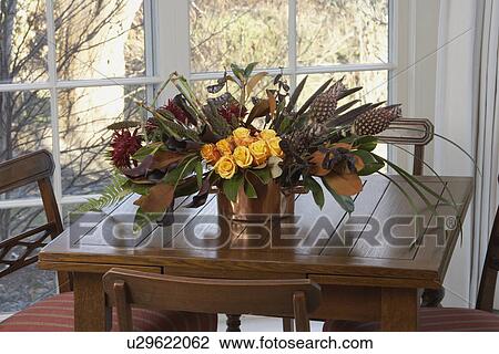 FLORAL ARRANGEMENTS: Tall pink Oriental lily in a glass vas sit on hall table in front of painted blue paneled door, sidelight to left, Floral Designer: Pillar Simon View Large Photo Image Stock Image - FLORAL ARRANGEMENTS: Tall pink Oriental lily in a glass vas sit on hall table in front of painted blue paneled door, sidelight to left, Floral Designer: Pillar Simon. Fotosearch