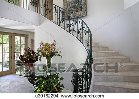 Flower vases on table by staircase at home, California, USA View Large Photo Image Picture - Flower vases on table by staircase at home, California, USA. Fotosearch