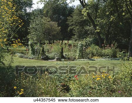 Flowers and plants in countryside garden View Large Photo Image Stock Photography - Flowers and plants in countryside garden. Fotosearch